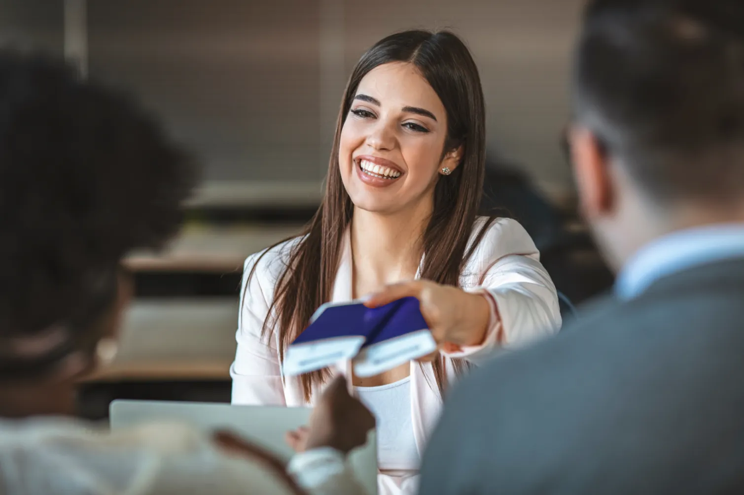 Smiling Lady Giving Passports